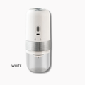 White handheld device with clear container on a white background