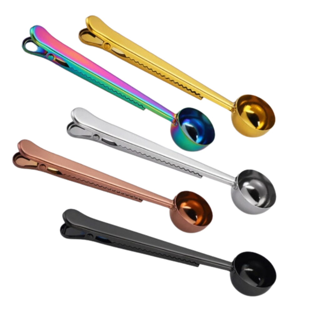 Set of colorful metal measuring spoons on a white background