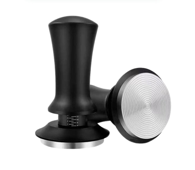 Black and silver coffee tamp on a white background