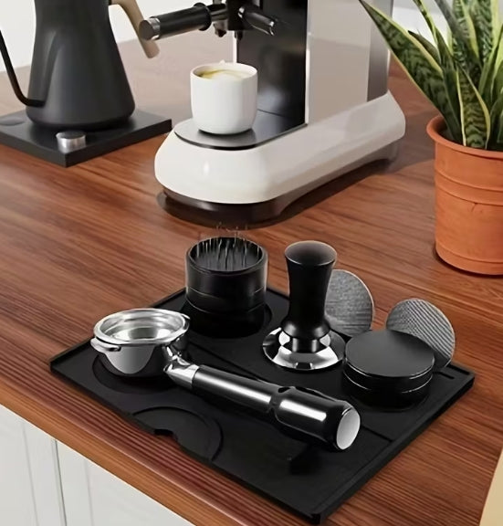Coffee brewing equipment on a wooden counter with a plant in the background